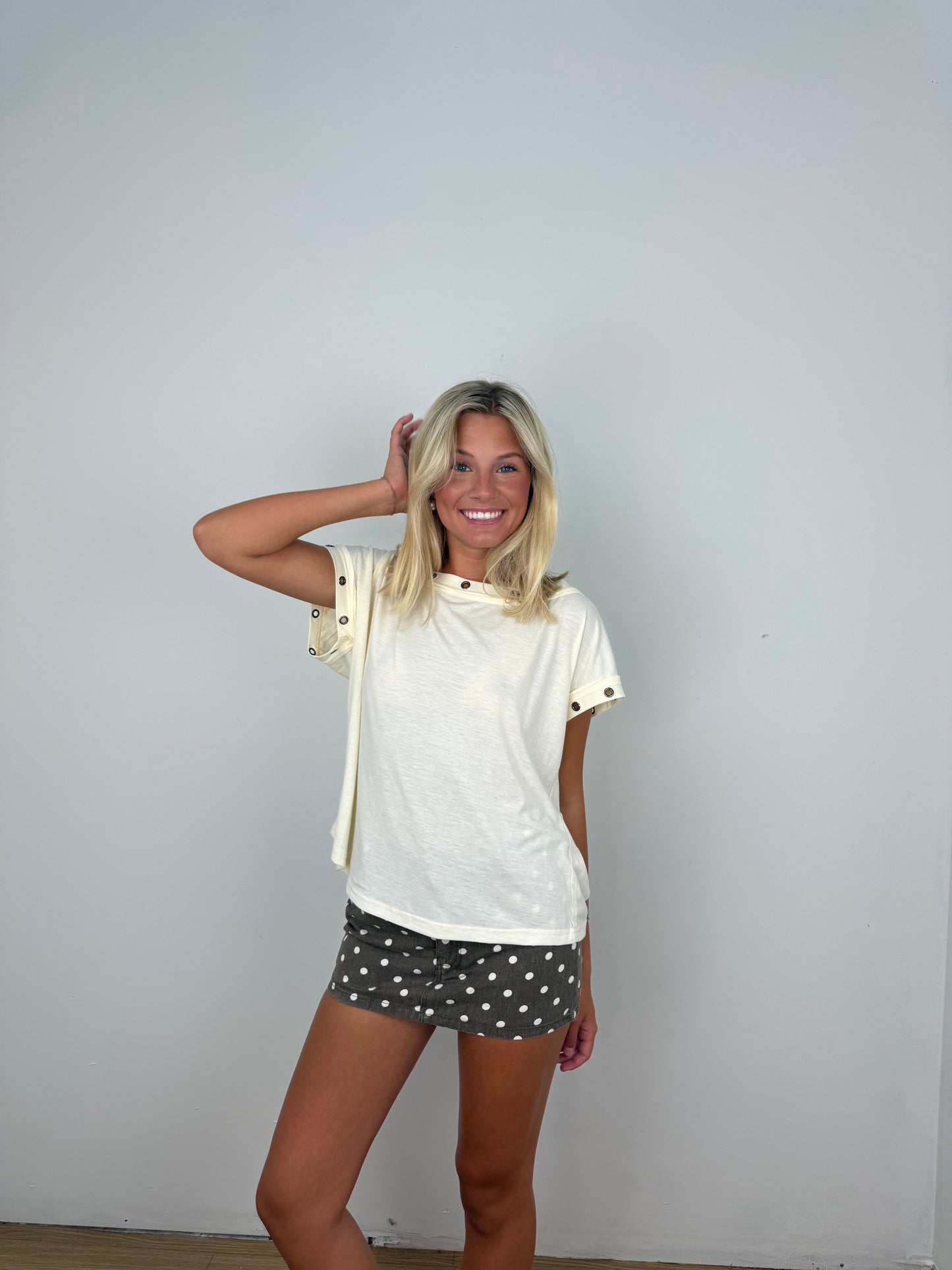 Metal trim eyelet top
