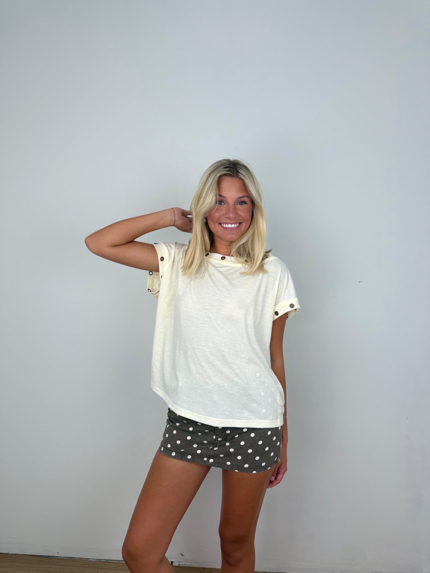 Metal trim eyelet top
